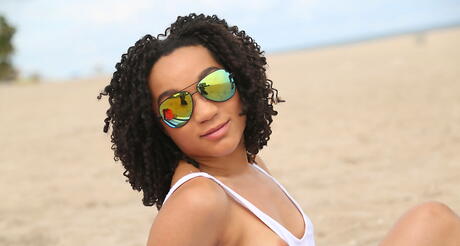 Sexy black dark hair amateur Pixie Minx exhibits her ass at beach